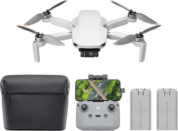 DJI Mini 4K camera drone in flight above countryside