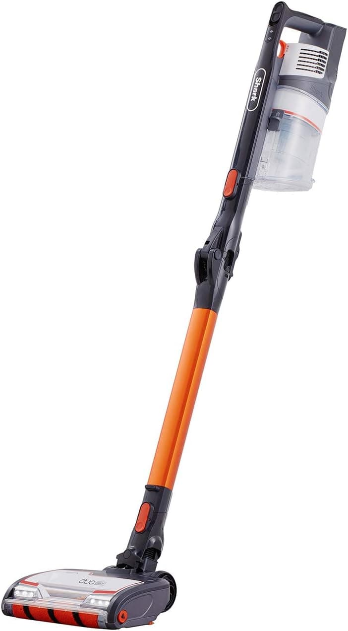 Shark IZ201UK cordless vacuum bending under a sofa